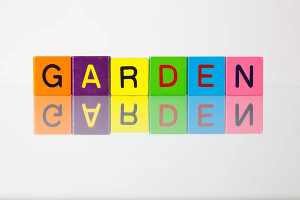 Garden - an inscription from children's  blocks — Stock Photo, Image