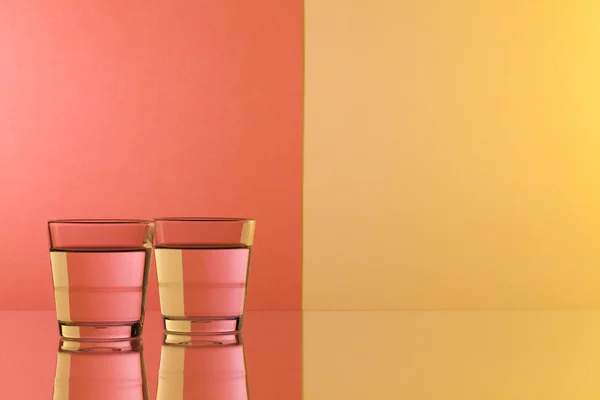 Glasses of water on the glass desk — Stock Photo, Image