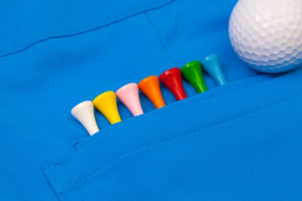 Calças azuis e equipamentos de golfe — Fotografia de Stock