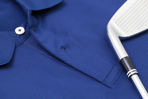 Blaues Poloshirt und Golfausrüstung — Stockfoto