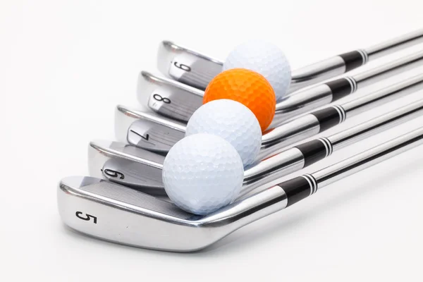 Titanium golf clubs on the white table — Stock Photo, Image