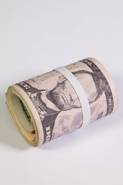 El rollo de billetes de dólar con banda de plástico sobre los ojos —  Fotos de Stock