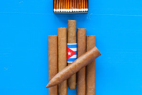 Detail of luxury Cuban cigars on the blue table — Stock Photo, Image