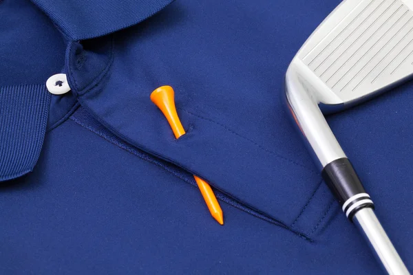 Blaues Poloshirt und Golfausrüstung — Stockfoto