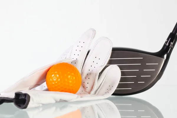 Golf driver and white glove on a glass table — Stock Photo, Image