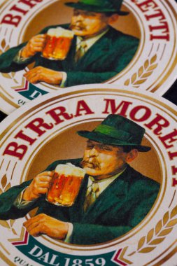 Budapest,Hungary-April 4,2014: Beermats from Birra Moretti - it  clipart