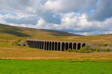 Famous Ribblehead Viaduct in Yorkshire Dales,England.It is 440 y clipart