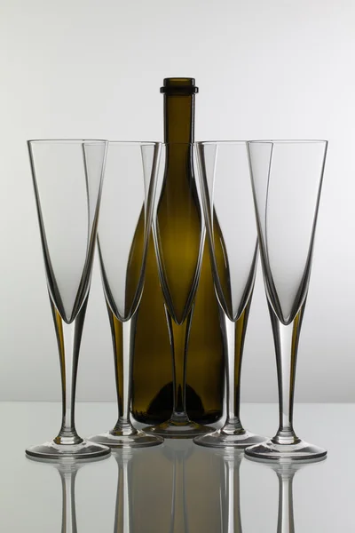 Empty champagne glasses on the glass table — Stock Photo, Image