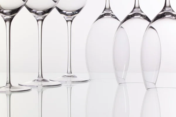 Six wine glasses on a glass desk — Stock Photo, Image