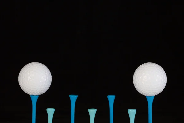 Golf balls and wooden tees — Stock Photo, Image