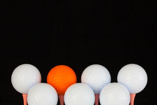 Golf balls and wooden tees — Stock Photo, Image
