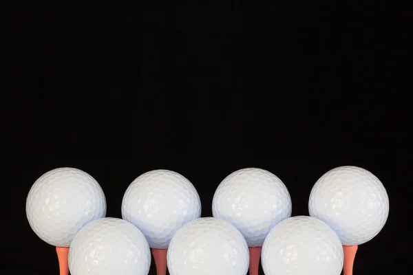 Bolas de golfe e camisetas de madeira — Fotografia de Stock