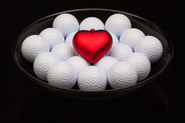 Bol en céramique noire rempli de balles de golf — Photo