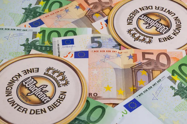 Beermats from Warsteiner beer and eur money. — Stock Photo, Image