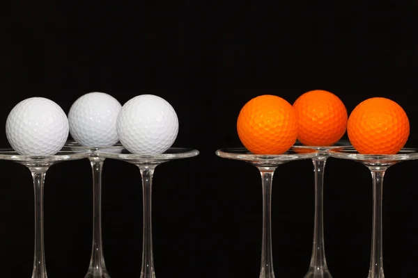 Tres copas de champán y pelotas de golf —  Fotos de Stock