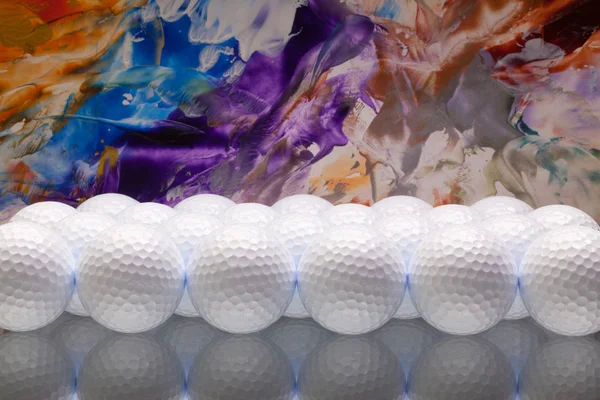 Bolas de golf blancas en un escritorio de cristal — Foto de Stock