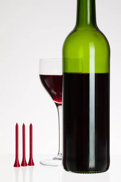 Wine glass and bottle with red wine — Stock Photo, Image