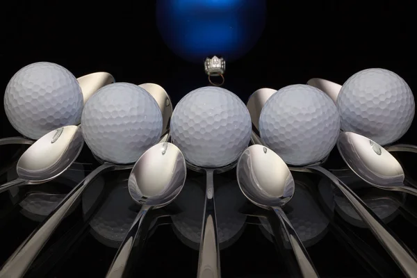 Blue Christmas decoration, golf balls and nine spoons — Stock Photo, Image