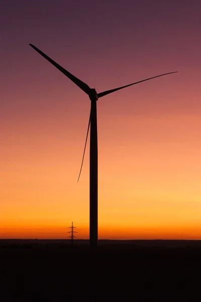 Windfarm at sunset and sky with dust from volcano — Stock Photo, Image