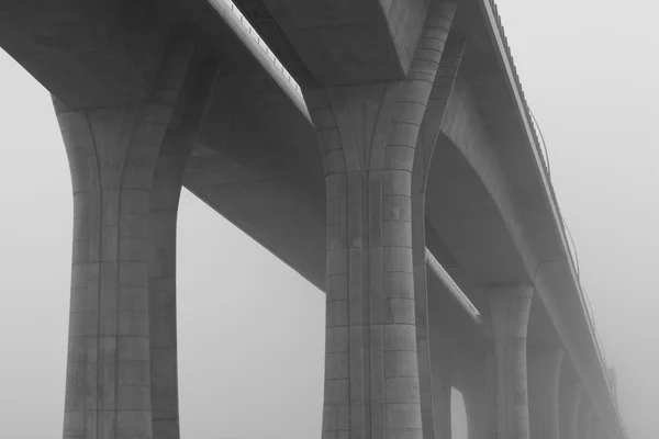 Highway viaduct in the  mist — Stock Photo, Image