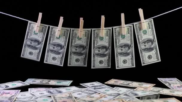 Dirty US dollar banknotes hanging from a clothesline — Stock Video