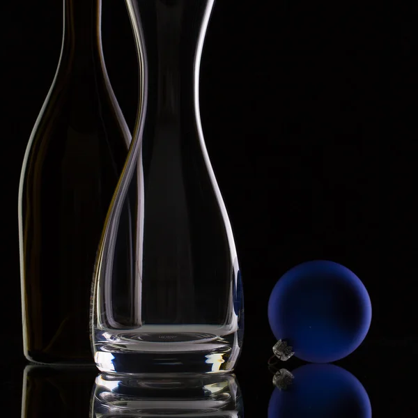 The bottle of wine,glass carafe and Christmas decoration