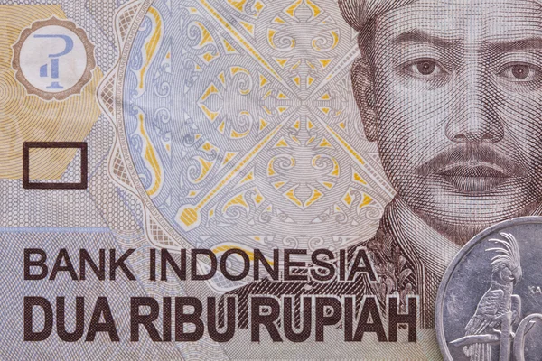 Nota e moedas de rupias monetárias indonésias — Fotografia de Stock