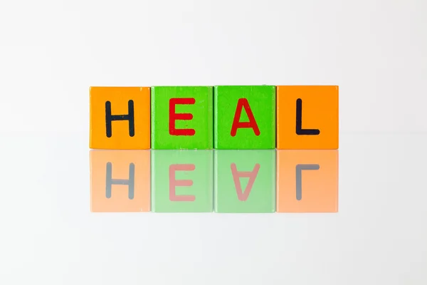 Heal  - an inscription from children's blocks — Stock Photo, Image