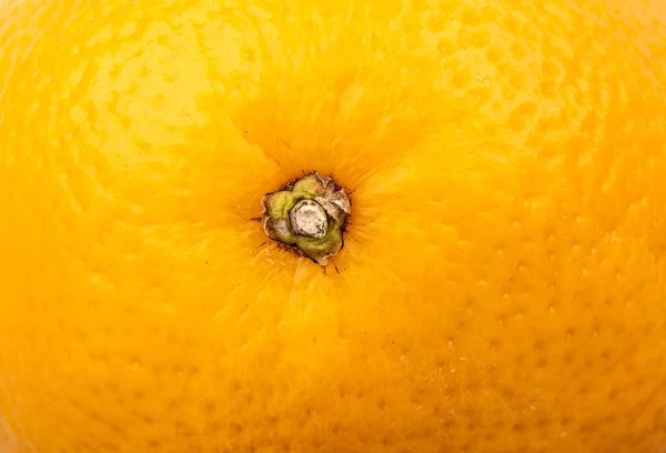 Textura de cerca de la piel naranja. Marco completo de una naranja sin pelar. — Foto de Stock