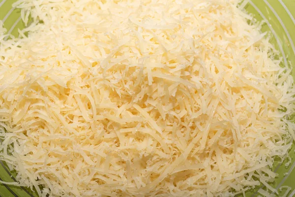 Grated Hard Cheese Green Plate Food Background Top View Close — Stock Photo, Image
