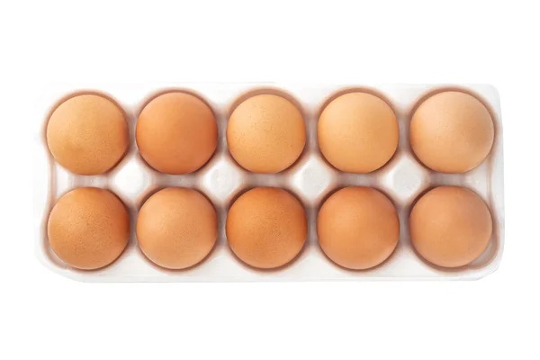 Коричневые Яйца Белом Пластиковом Подложке Изолированы Белом Фоне Вид Сверху — стоковое фото