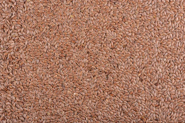 Background from a pile of natural flax seeds. — Stock Photo, Image