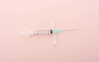 Plastic medical syringe 25 ml on the cap from the needle. Copy space.