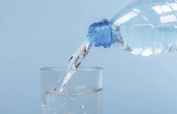 Pouring Water Plastic Bottle Glass Close — Stok fotoğraf