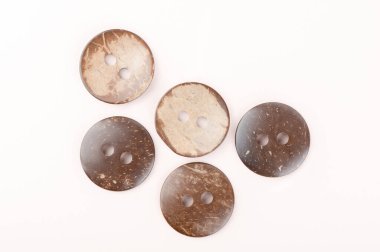 Several brown marbled plastic buttons on both sides.
