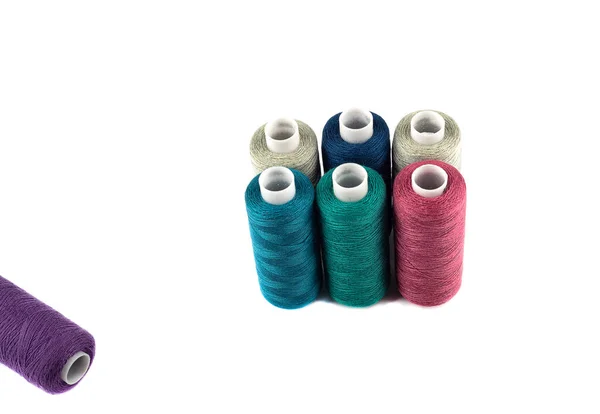 Spools of colored thread on a white background. — Stock Photo, Image