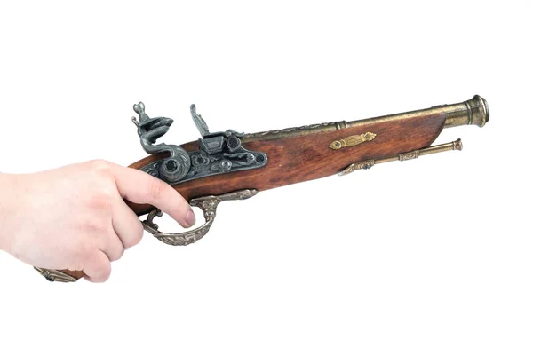 Human hand on the trigger of a mock-up of an old pistol. — Stock Photo, Image