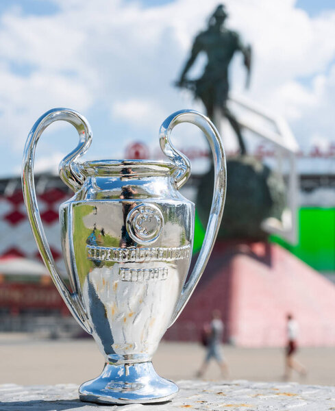 June 14, 2021 Moscow, Russia, UEFA Champions League Cup in front of a modern stadium.