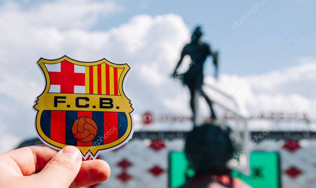 June 14, 2021 Barcelona, Spain. The emblem of the football club FC Barcelona against the background of the modern stadium.