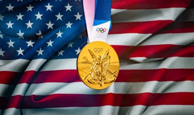 April 22, 2021 Beijing, China. Olympic gold medal against the background of the flag of the United States of Ameria (USA). clipart