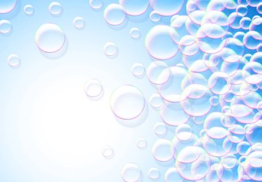 Sabun köpüğü mavi arka planda gökkuşağı renkli hava köpüğü