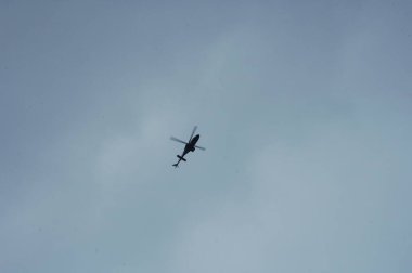 Helicopter flying close to earth