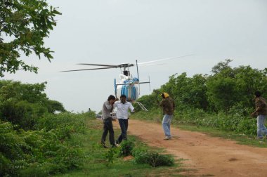 Helicopter flying close to earth