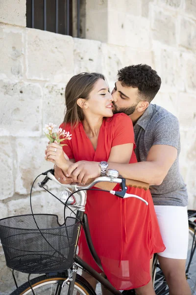 Young Couple Hugging Bicycle Kissing She Holding Some Flowers Wearing Royalty Free Stock Images