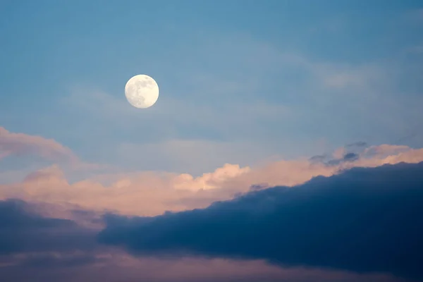 Full Moon with Clouds in the Night Sky Background. Nighttime, Moon in the Sky