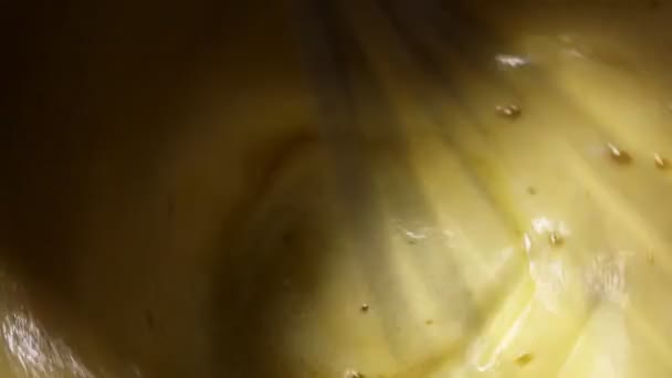 The process of beating eggs with melted butter — Stock Video