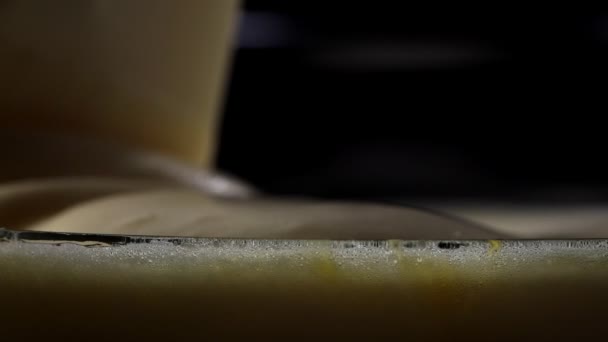 Pastry cream, whipped protein is beautifully poured into a bowl. close-up — Stock Video