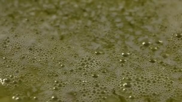 Macro video of boiling butter. boiling oil close up. The butter melts in the pan. Cooking desserts. — Stock Video