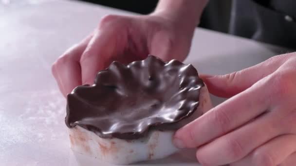 Pastry chef makes chocolate cake decorations. Dessert making process — Stock Video