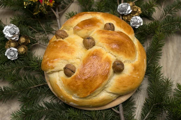 Christmas bread with walnuts on the Christmas tree branch fir